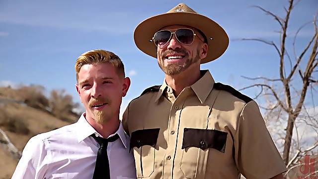 Gay BDSM scene with a handsome man getting fucked by a cop