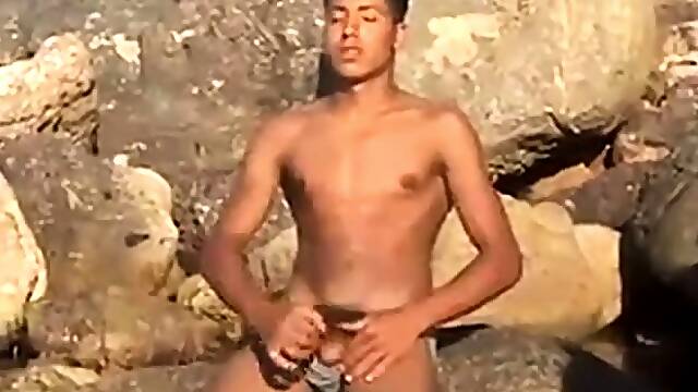 Arab Twink Strokes His Big Dick Outdoors by the Beach