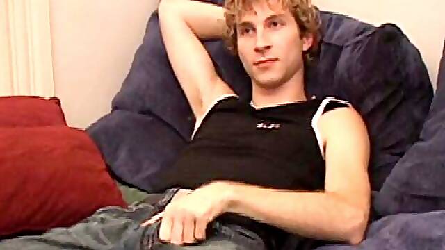 Amateur Jenson McGill rubs his crotch while watching porn, strips off clothes to stroke stiff cock & cum on face