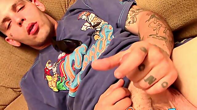 Tattooed straight thug plays with his small shaft and cums
