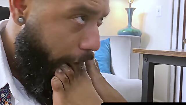 MaleFeetXXX.com - Bearded black stud licks bosss feet while strokes his big cock